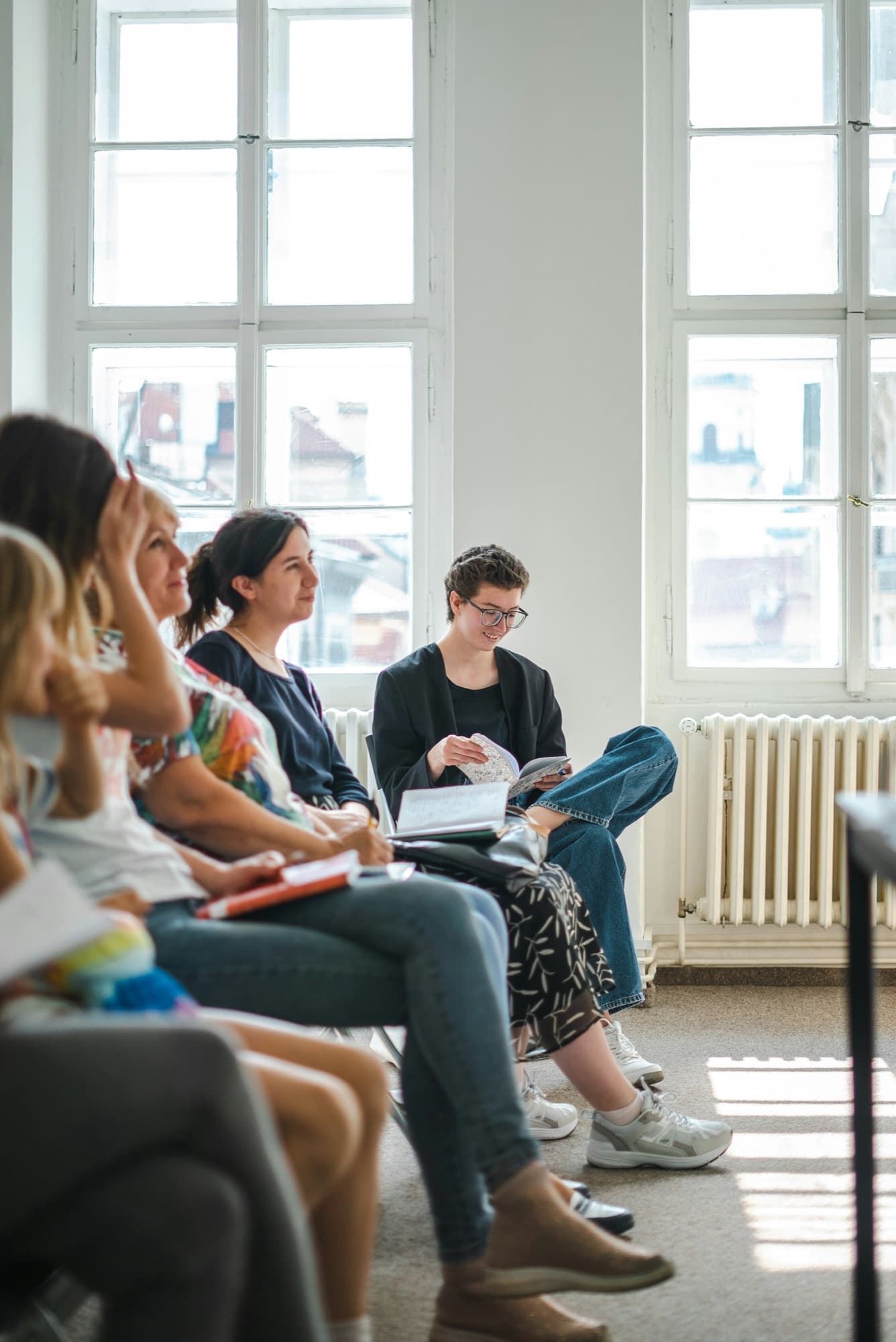 A room of women engaged in a workplace training session